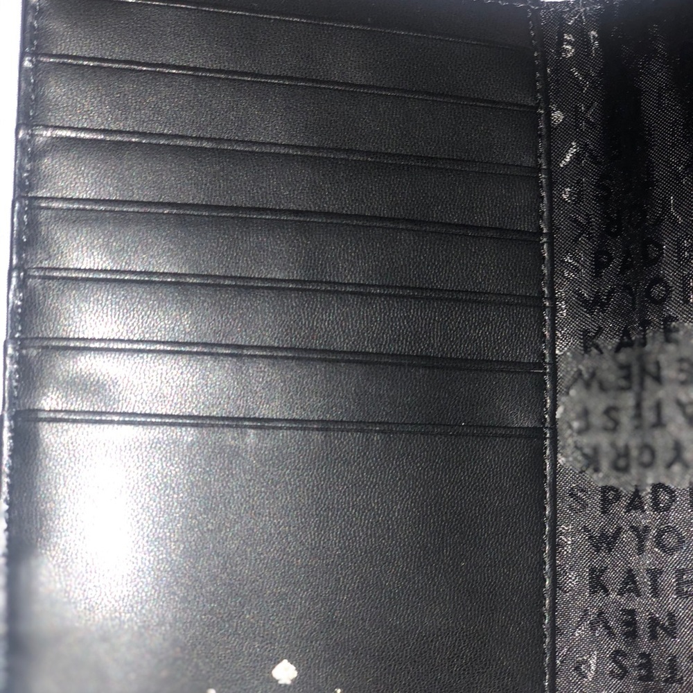 Kate Spade black leather slim bifold wallet